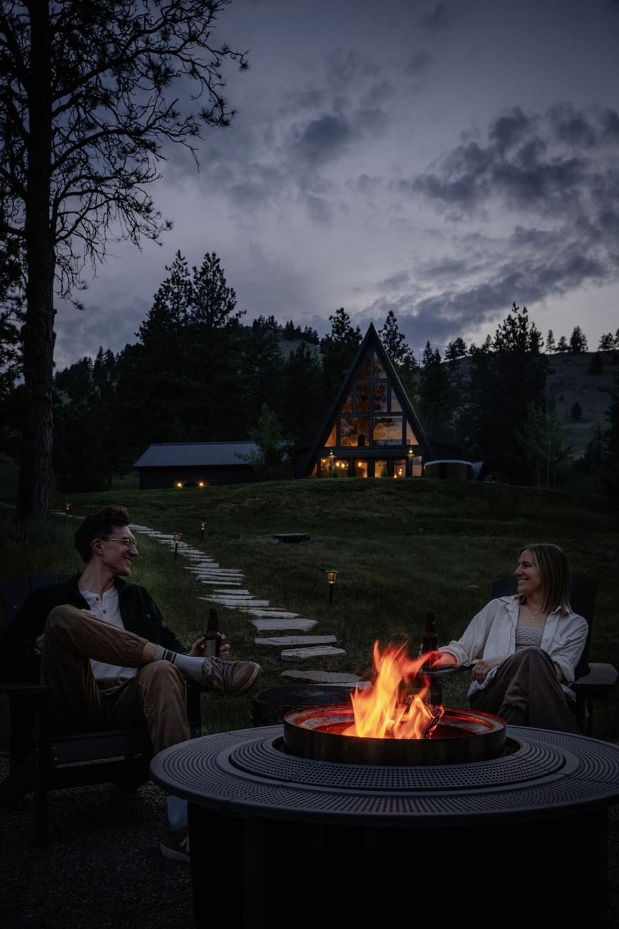 Couple by the firepit in the evening