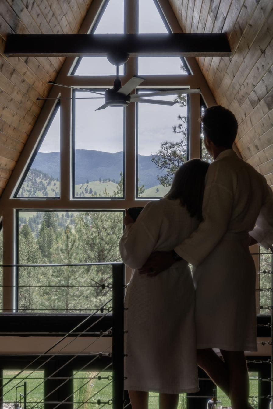 Guests in robes taking in the mountain view