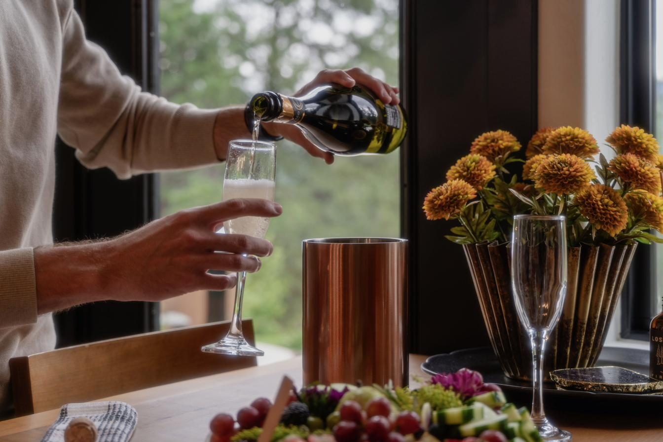 Champagne and charcuterie welcome spread with fresh flowers